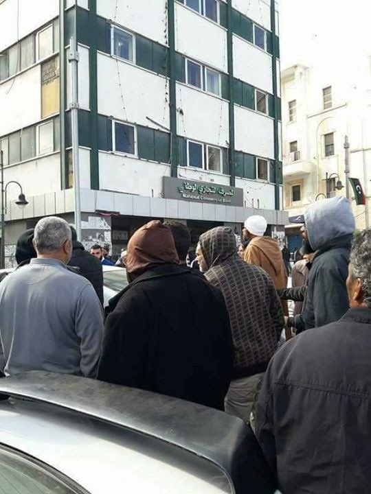 Protests in Martyr Square Tripoli  against closure of banks due to lack of cash. Road blocked Libya  