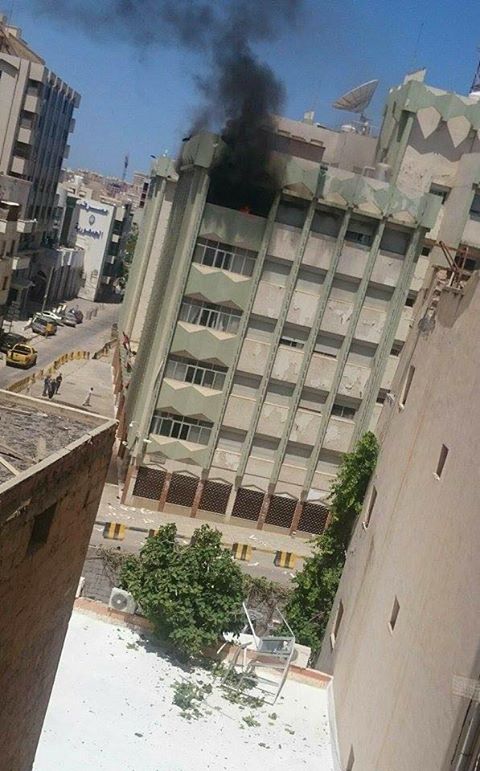 Libya- smoke rising from top floor of Eni HQ in central Tripoli as part of ongoing and large scale militia fighting across the city  