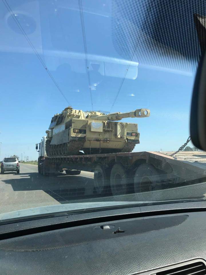 Trucks carrying tanks and howitzer in Qawaya area of Tripoli