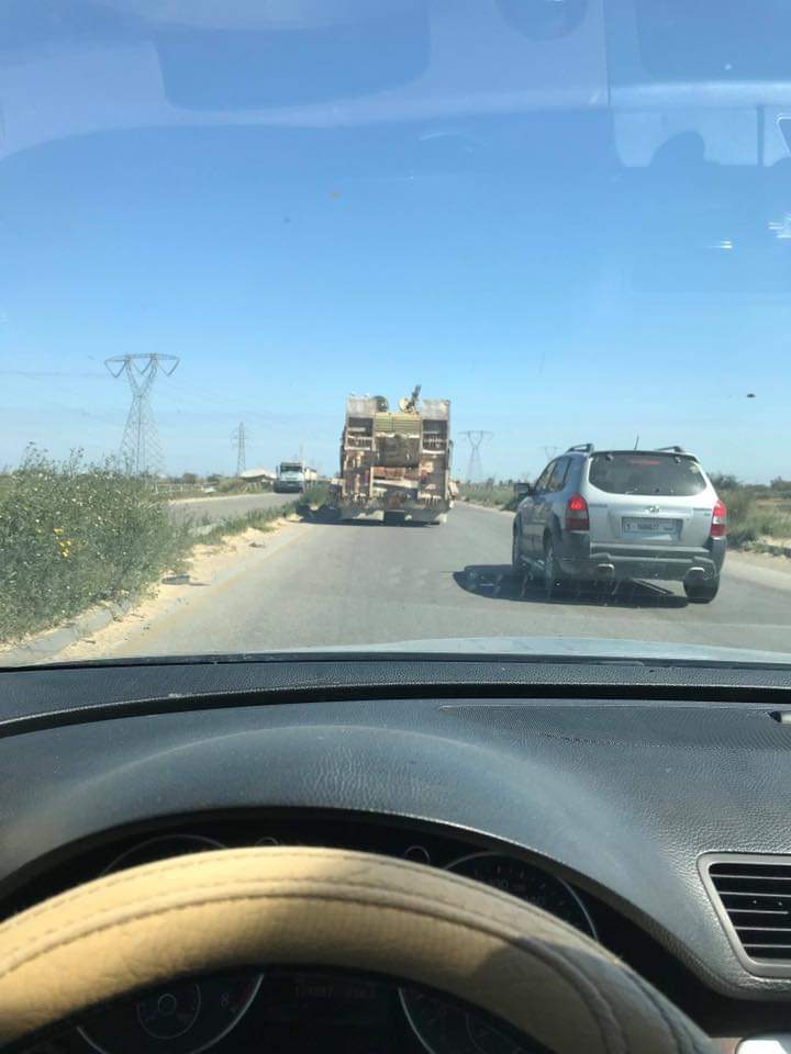 Trucks carrying tanks and howitzer in Qawaya area of Tripoli