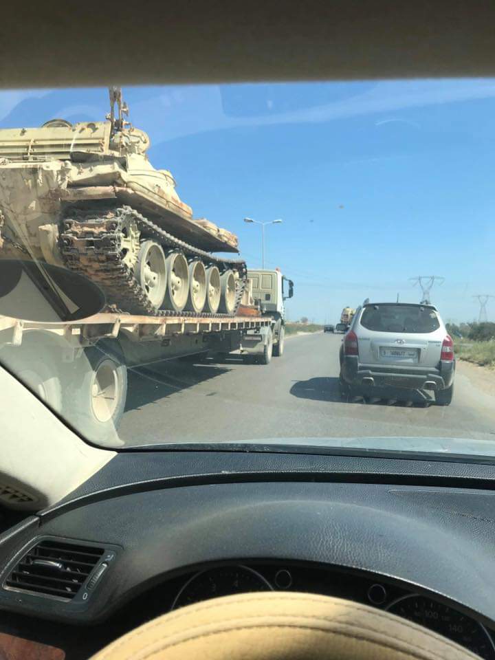 Trucks carrying tanks and howitzer in Qawaya area of Tripoli