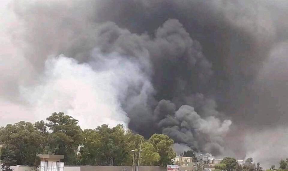 Photos showing smoke still billowing from the targeted ammunition depot inside Tajoura's Rahba barracks. 