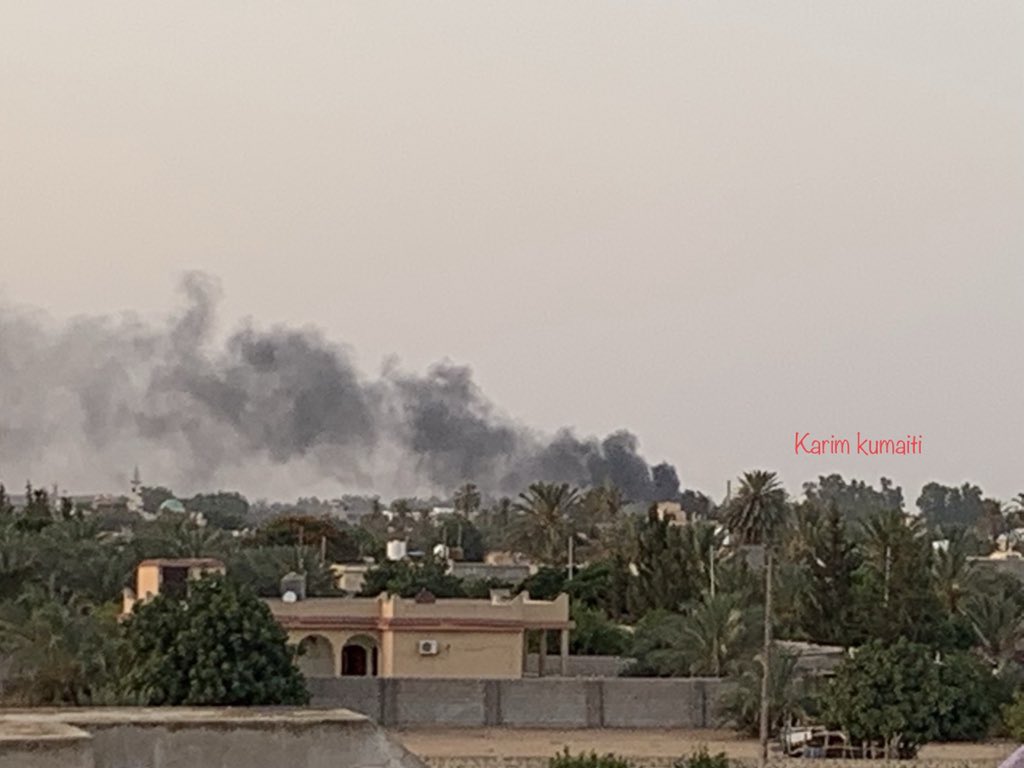 Smoke rises as shell hit a house on the airport road