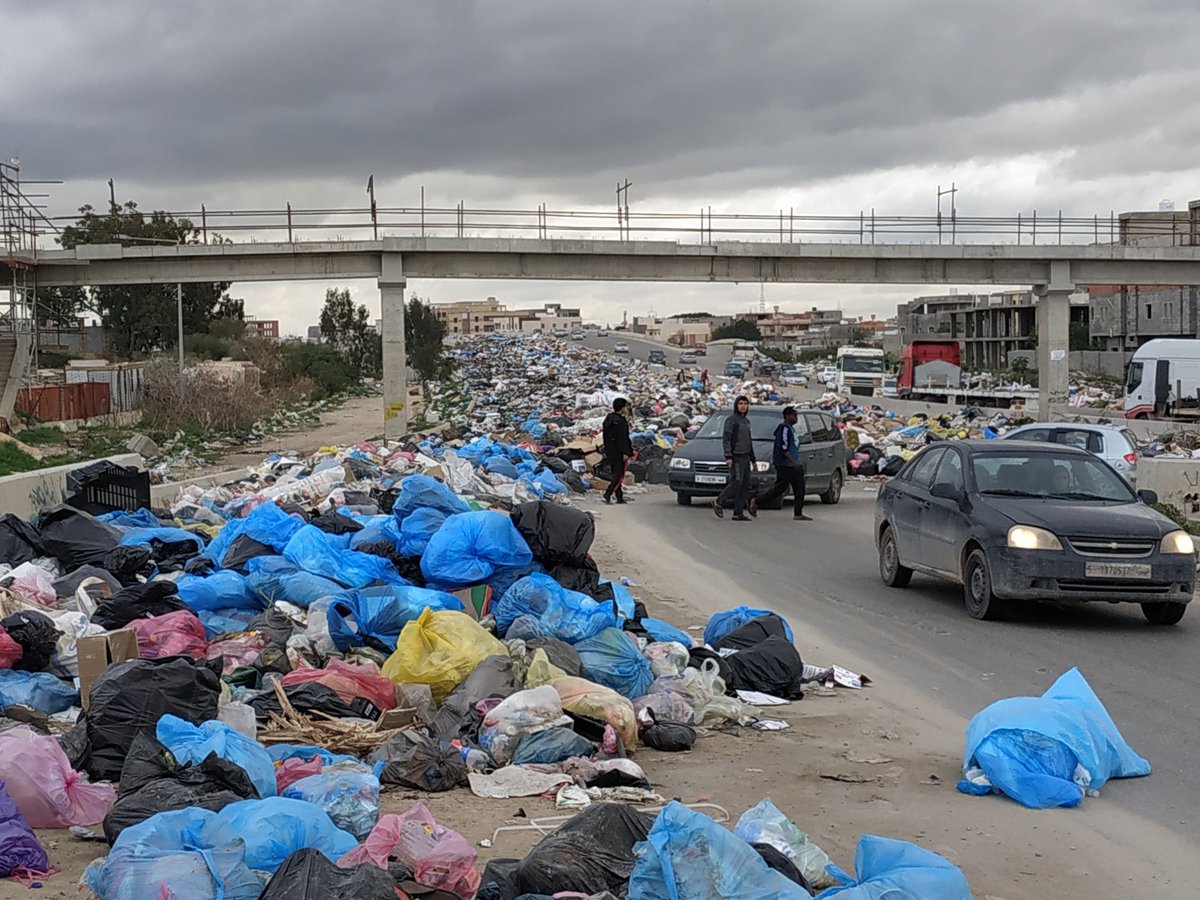 A part of the second ring road blocked by garbage in Tripoli as the main dump is out of reach because of the fights